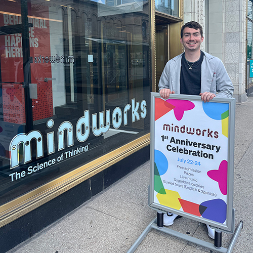 A research assistant stands by the entrance to Mindworks 