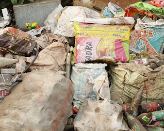Pile of various kinds of paper, glass, and other waste